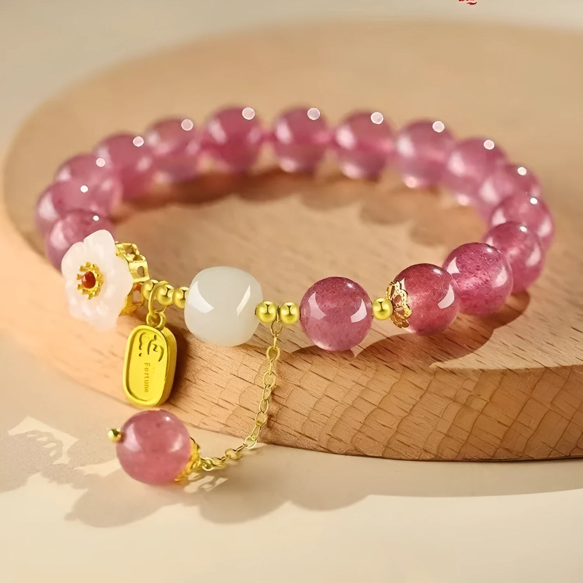 Handmade strawberry quartz crystal bracelet with Hetian jade peach blossom charm for women