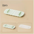 Food-grade plastic high capacity ice cube tray with grid and stored ice shovel in blue colour.