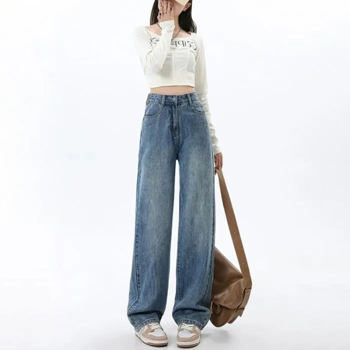 A woman wearing high-waisted retro blue wide-leg jeans made from stretch denim.
