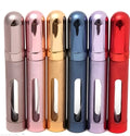 Slim 12ml aluminium travel perfume bottle with glass liner in choice of six colours including blue, gold, and pink.