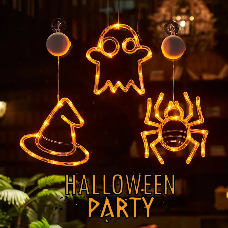 Halloween battery-powered LED window lights with suction cups showing spider, pumpkin and ghost designs