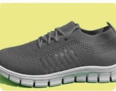 Women's black flying knit casual flat shoes with mesh upper and front tie lace.