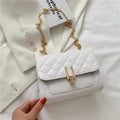 Women's solid colour crossbody bag with diamond lattice chain strap in black, shown from the front.