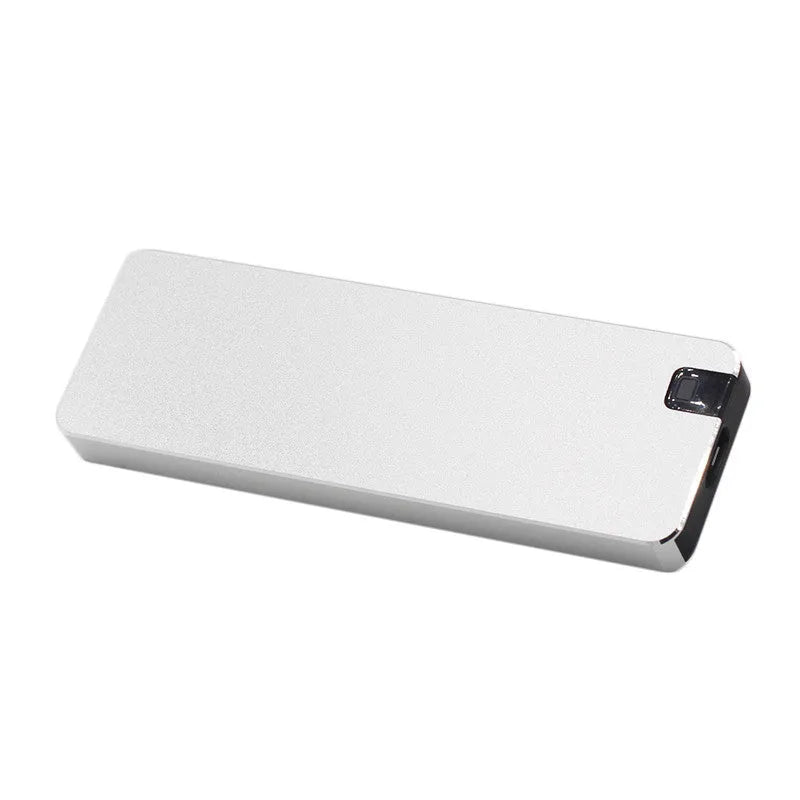 Compact silver portable solid state hard drive with USB cable on a dark surface