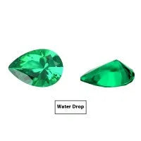 Cultivated emerald loose gemstones in round and fancy cut shapes on a dark background.