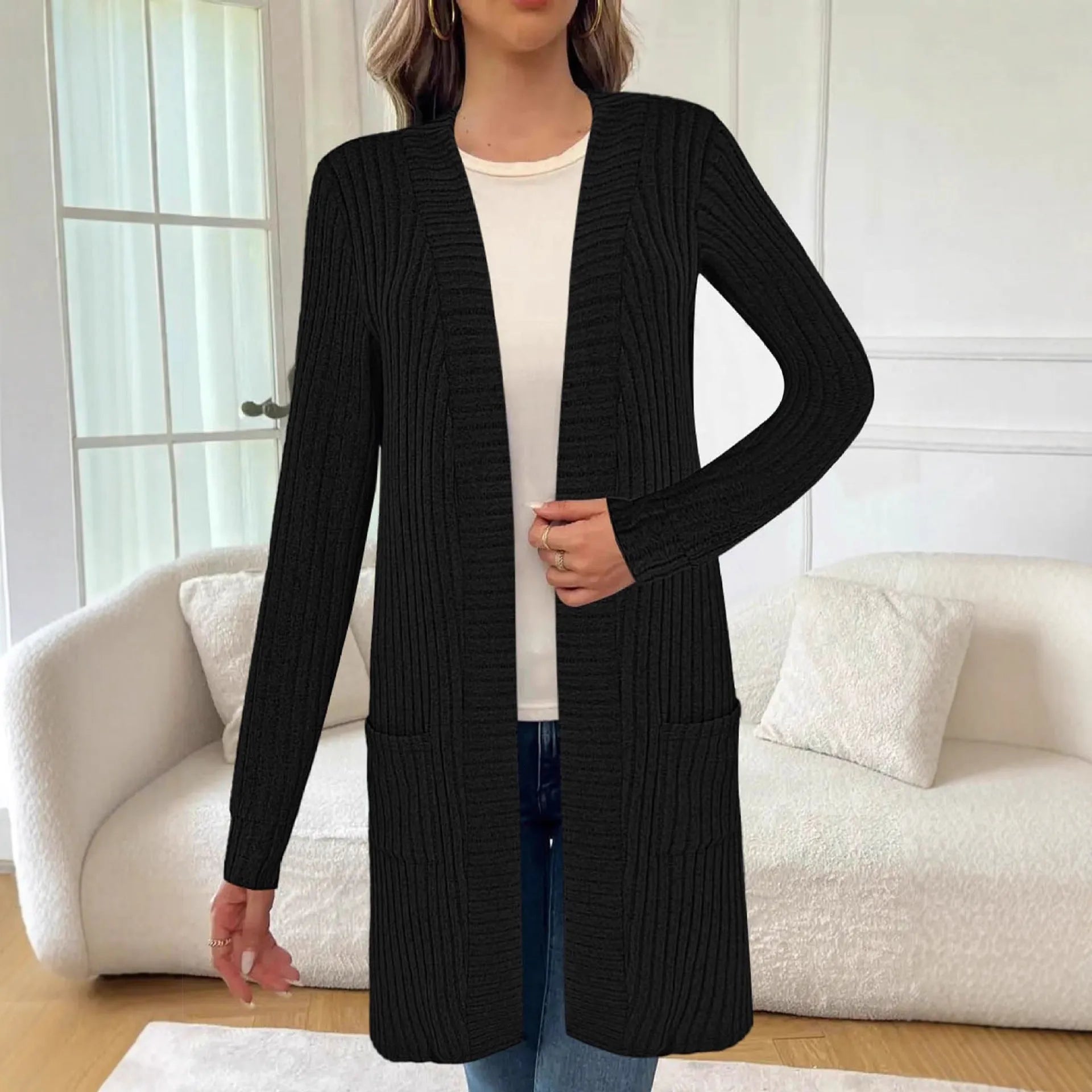 A loose-fit long sleeve knitted cardigan jacket in grey with front pockets.