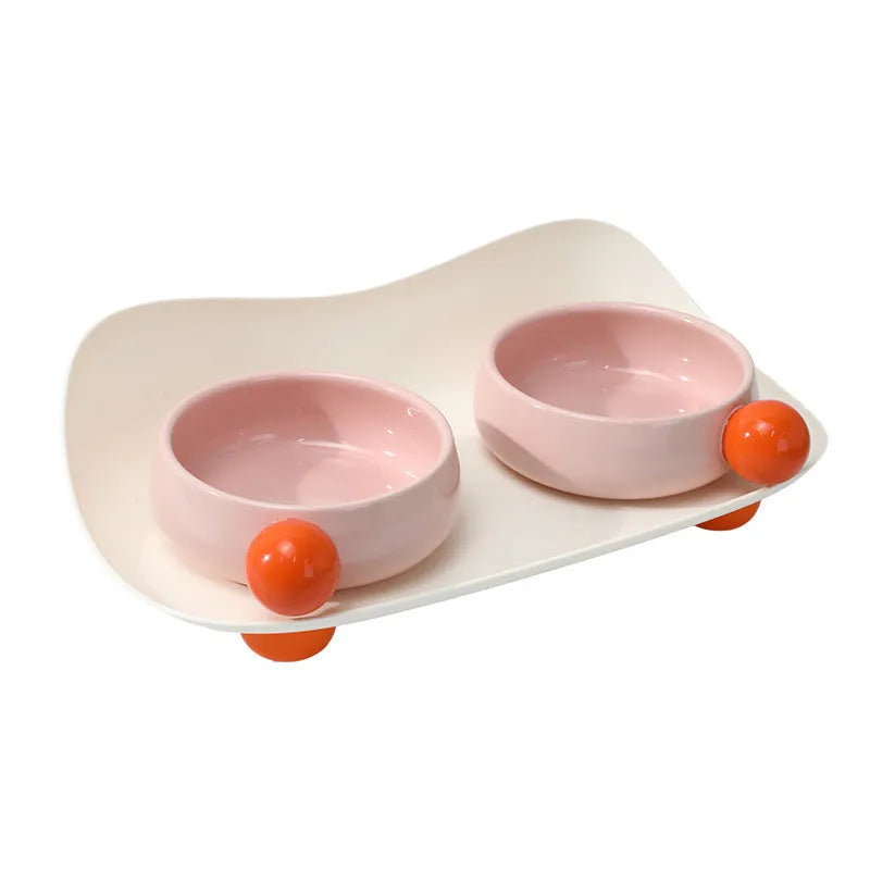 Elevated ceramic pet feeding bowl set with two bowls on raised platform