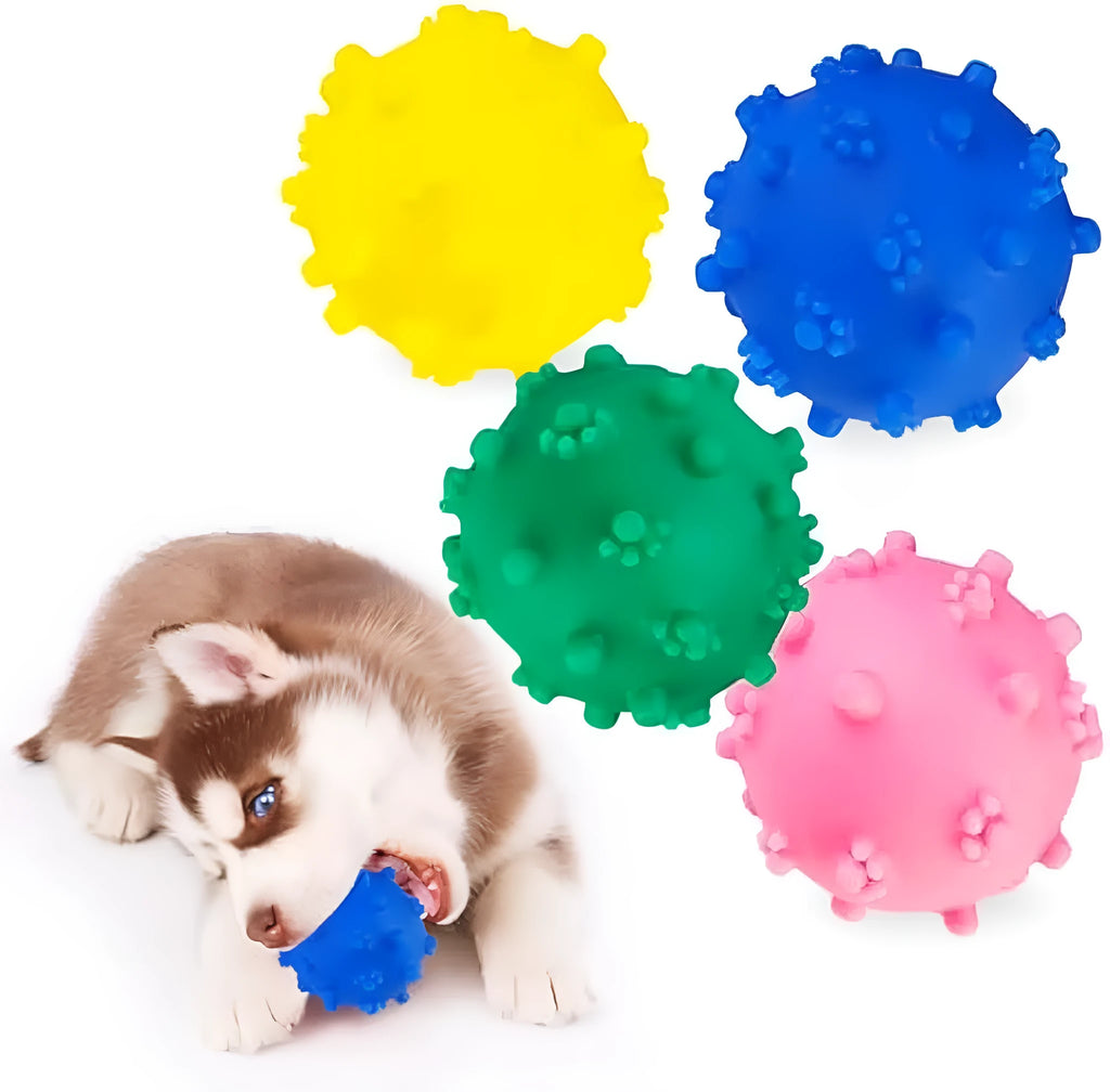 Set of four brightly coloured spiked squeaky dog balls on a blue background