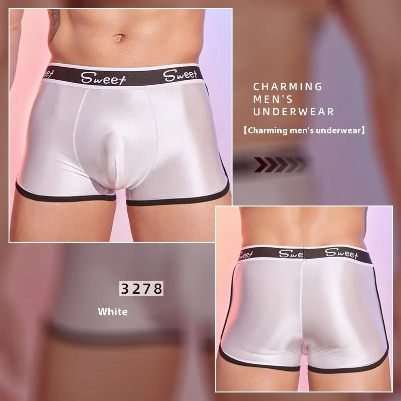 Men's silky nylon boxers in black, white, and sapphire blue colours on a white background.