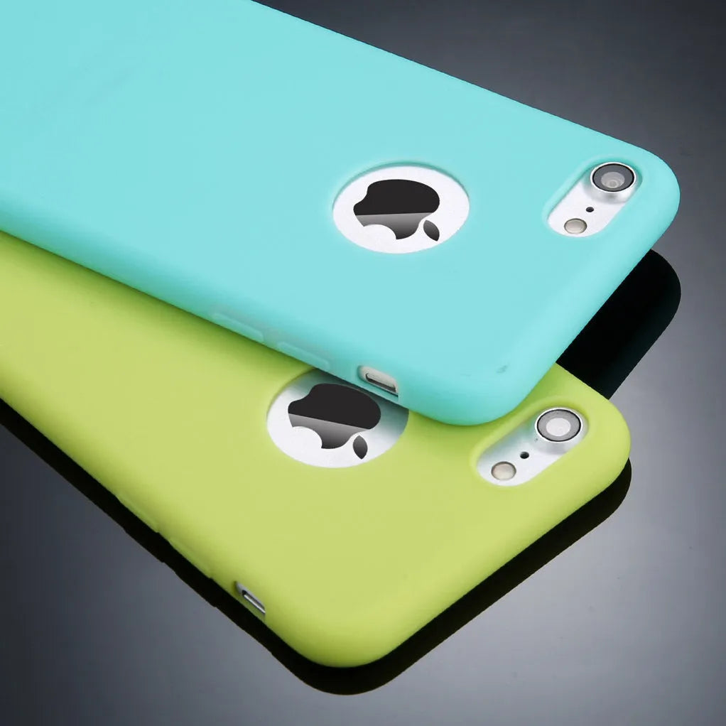 Plain soft silicone TPU phone case for iPhone in a candy colour on a table.