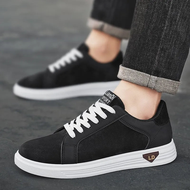 Men's black snake pattern leather low-top sneakers with round toe and flat rubber sole.