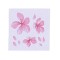 Close-up of a pink and white cherry blossom car sticker on a clear PVC backing.