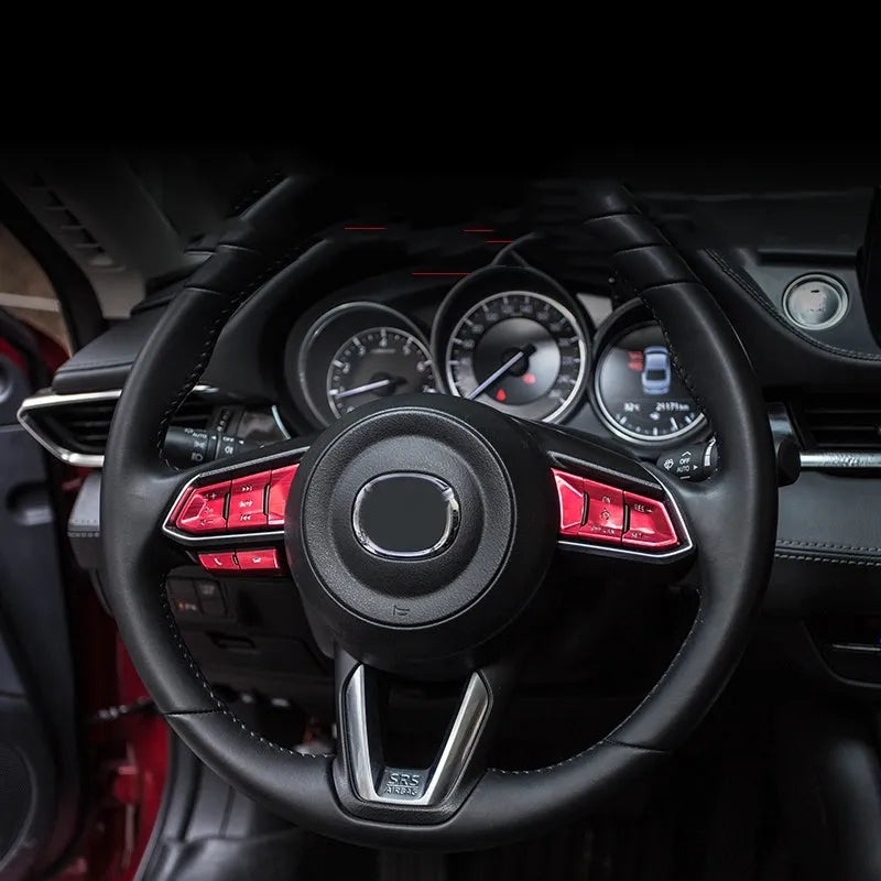 Atz aluminium alloy decorative stickers for car steering wheel buttons and interior trim, showing brushed metal and carbon fibre finishes.