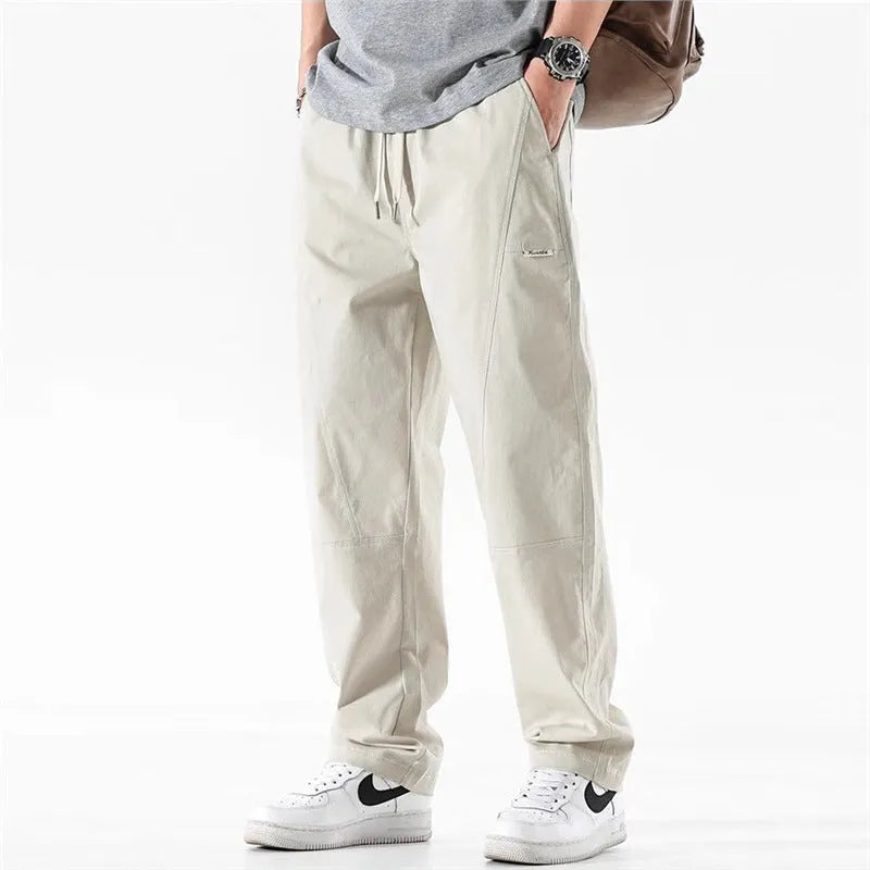 Women's milky white antibacterial cotton wide-leg casual trousers on a hanger.