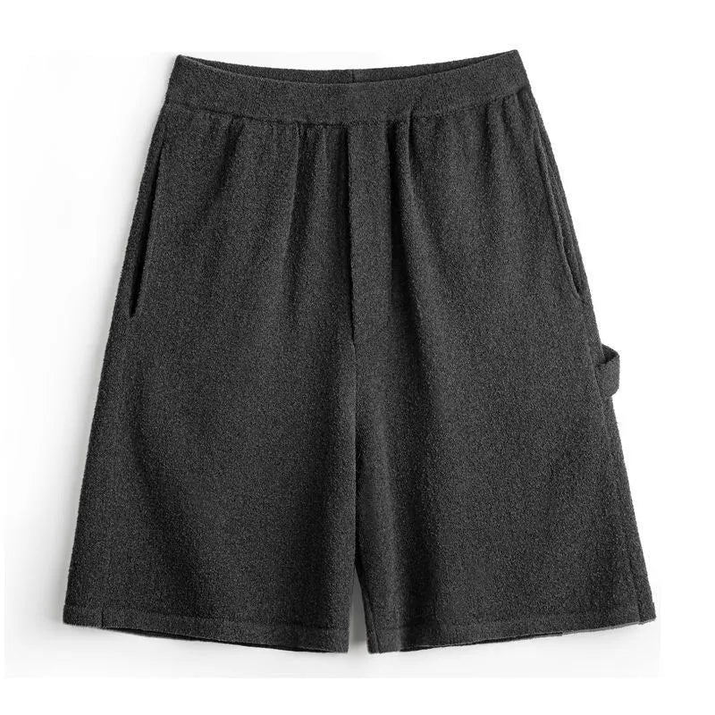 Cement grey men's straight-leg athletic shorts with elastic waistband on a plain background.