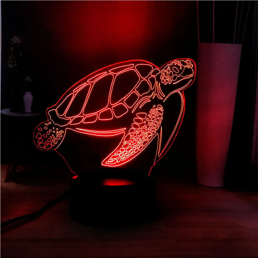 3D acrylic turtle-shaped LED night light with remote control on a table