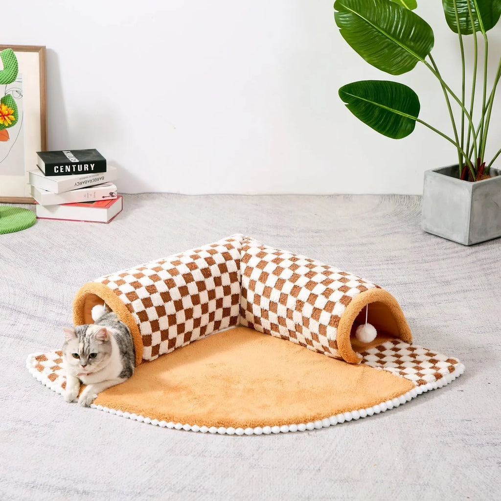 XL sized fan-shaped plush pet bed with integrated tunnel, shown in coffee colour with a non-slip granular base.