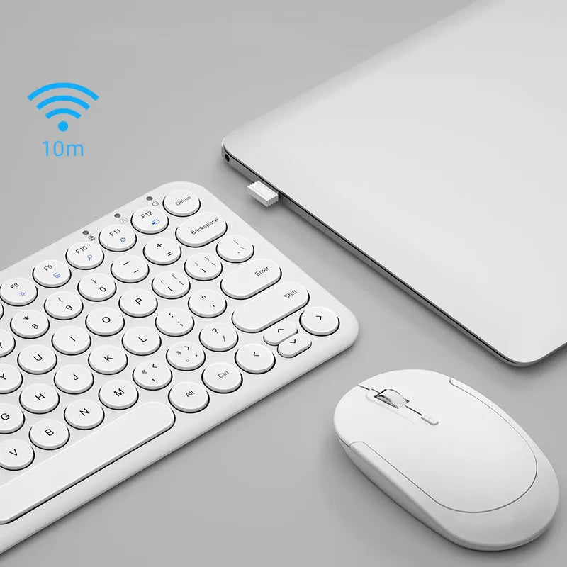 Mute ultra-thin wireless keyboard and mouse set in pink on a desk with USB receiver.