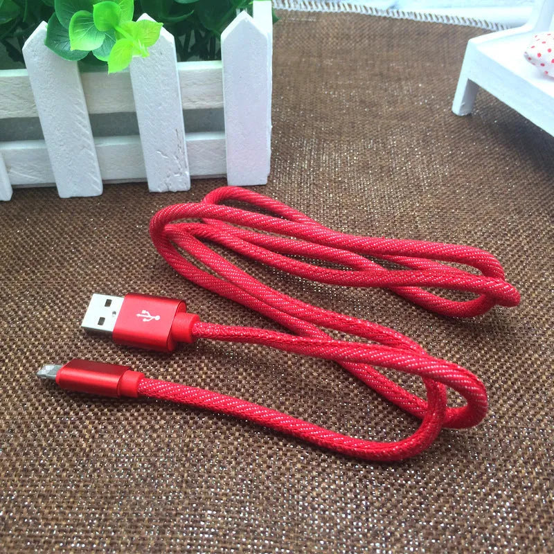 Close-up of a denim-braided USB-C cable with aluminium connectors in choice of colours.