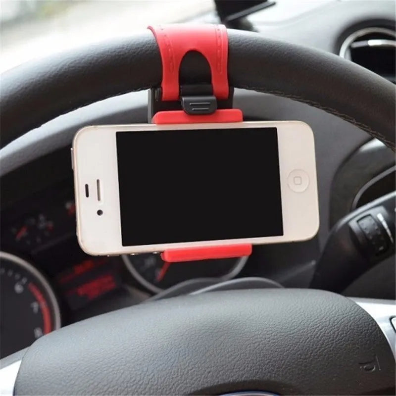 Black steering wheel phone holder mounted showing elastic clip and silicone phone padding