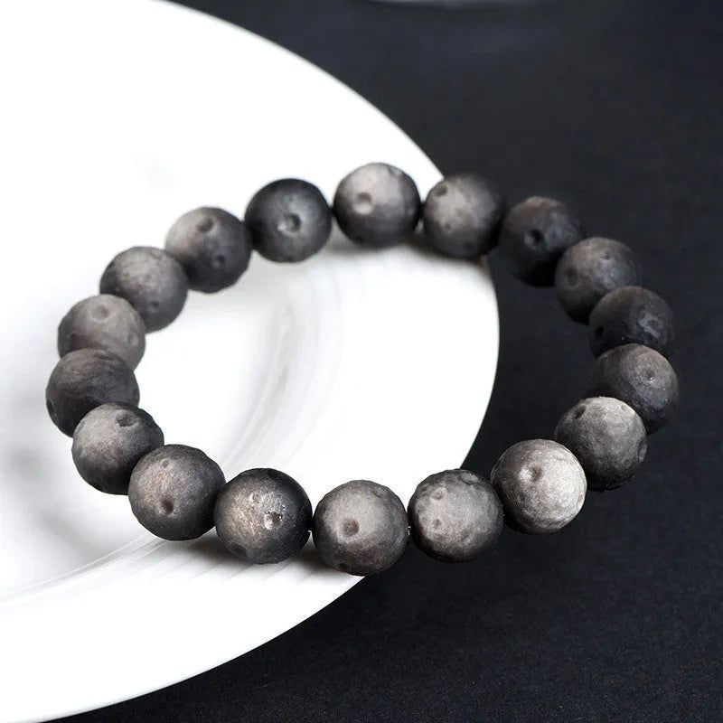 Natural obsidian crater ball bracelet with ground texture beads in silver or golden meteorite colours