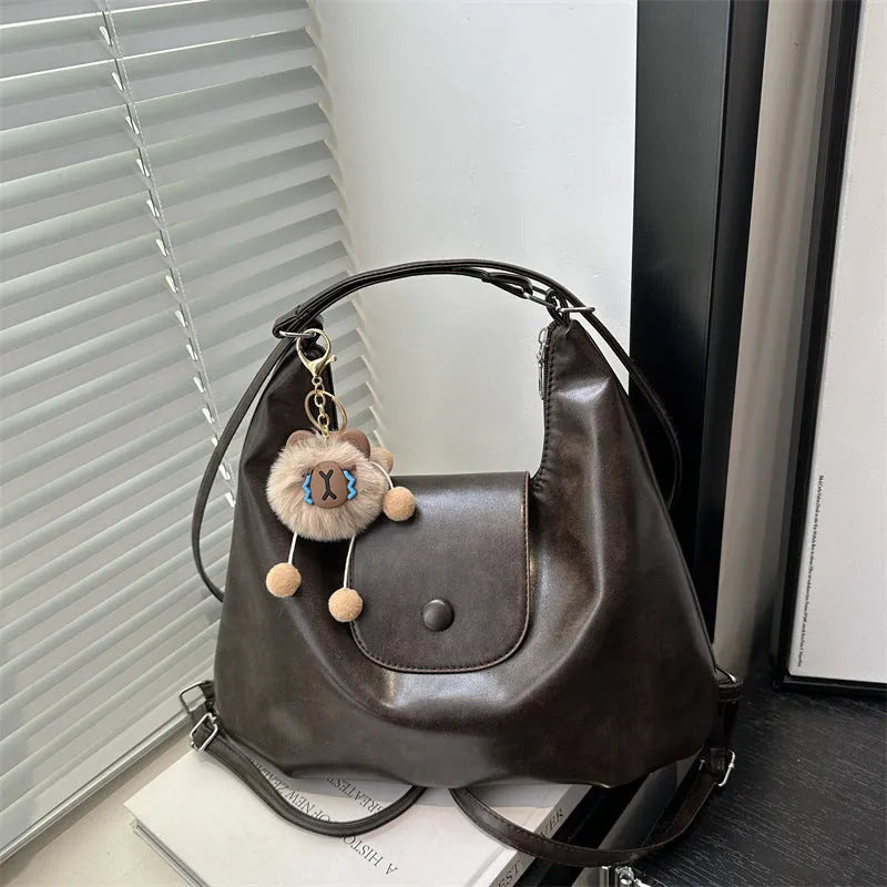 Textured PU leather commuter backpack with horizontal square design and single shoulder strap