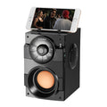 Black portable audio system with subwoofer, USB cable, and 3.5mm audio connection cable