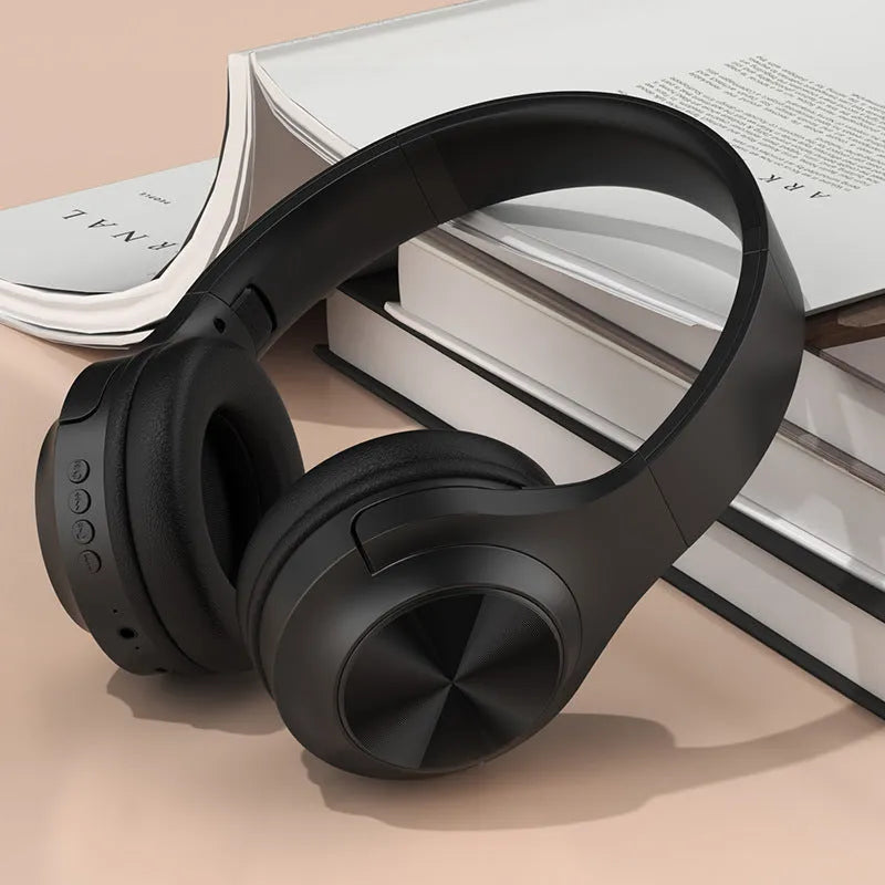 Wireless Bluetooth headset in ivory white, chalk black, or youth green colours showing head-mounted design and plastic construction