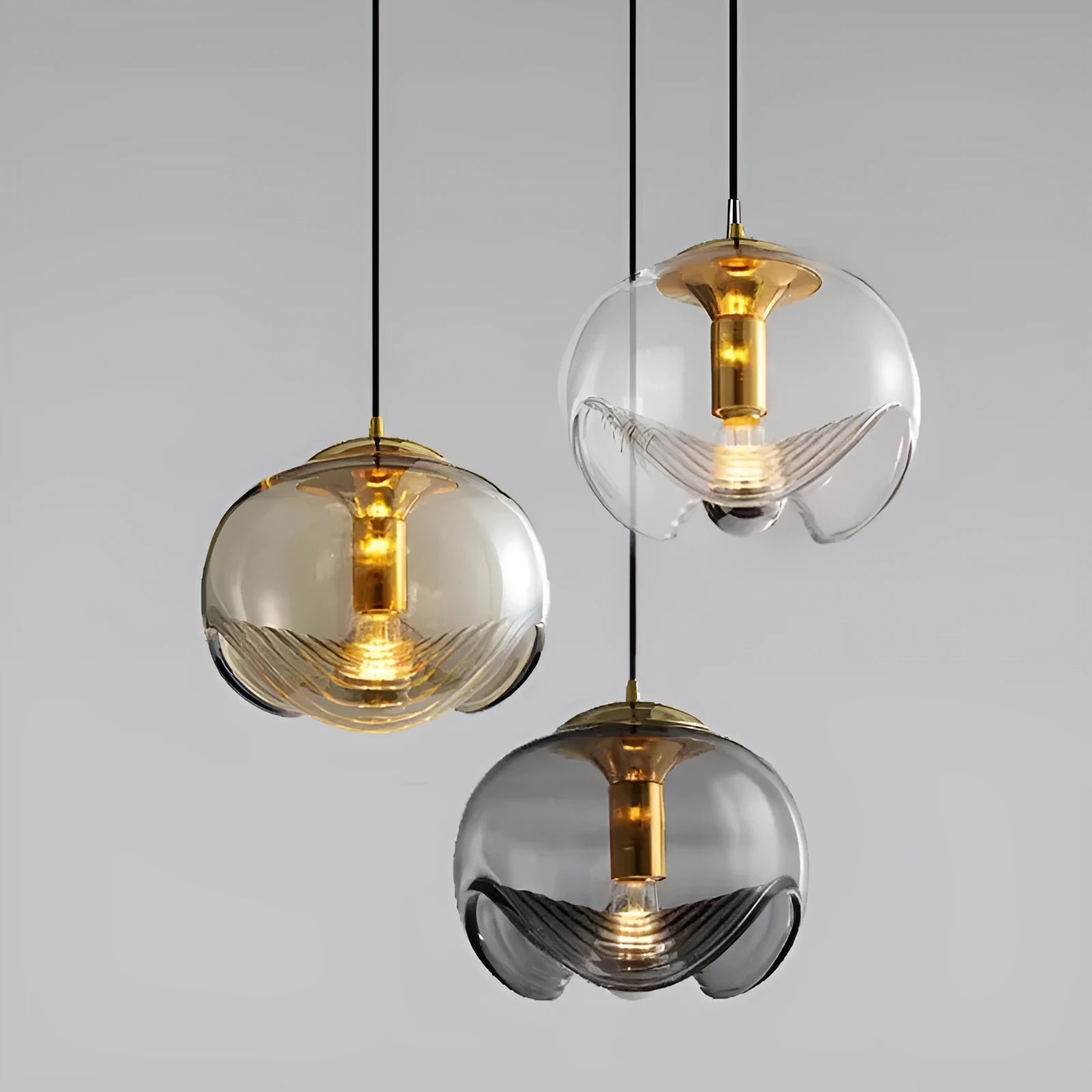 Modern glass chandelier with minimalist design showing transparent, amber and smoky grey light colour options