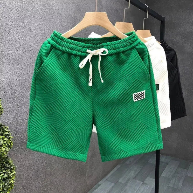 A pair of solid-colour casual sports shorts made from polyester, shown in white, suitable for beach and outdoor activities.