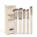 MAANGE apricot coloured 5-piece makeup brush set with angled blusher brush on a table
