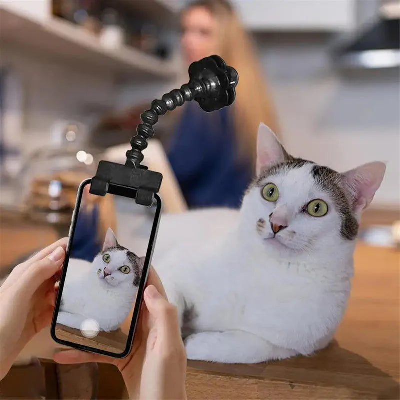 Black plastic pet photography tool with rotating clip for mobile phone attachment