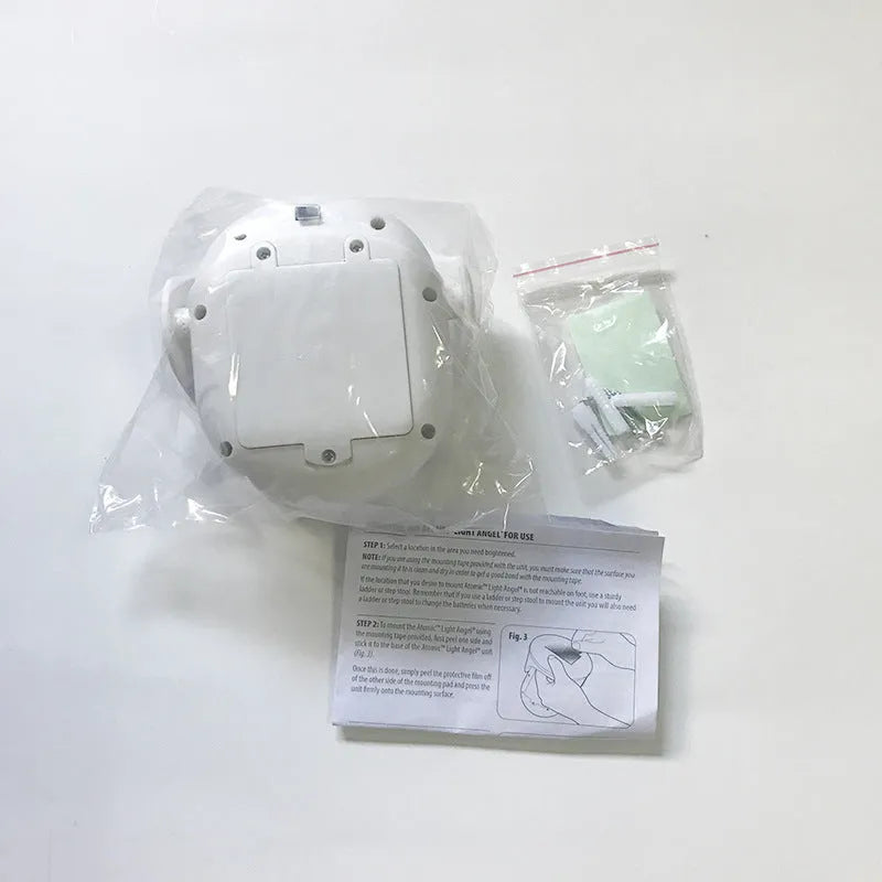 White Atomic Angel induction light unit with ABS plastic housing, showing compact size.