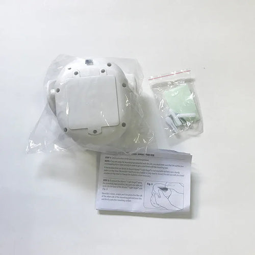 White Atomic Angel induction light unit with ABS plastic housing, showing compact size.