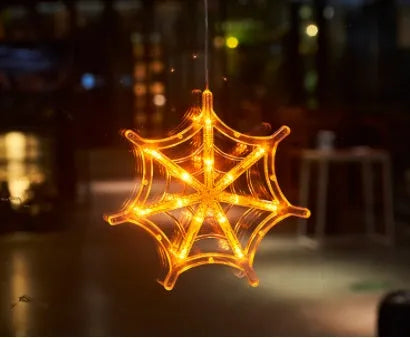 Halloween battery-powered LED window lights with suction cups showing spider, pumpkin and ghost designs