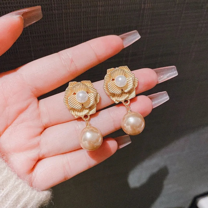 Gold Hong Kong style flower stud earrings with needle rose pearl design and opal stones