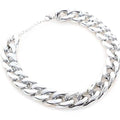 Geometric shaped gold colour dog collar with chain links and buckle on a white background.