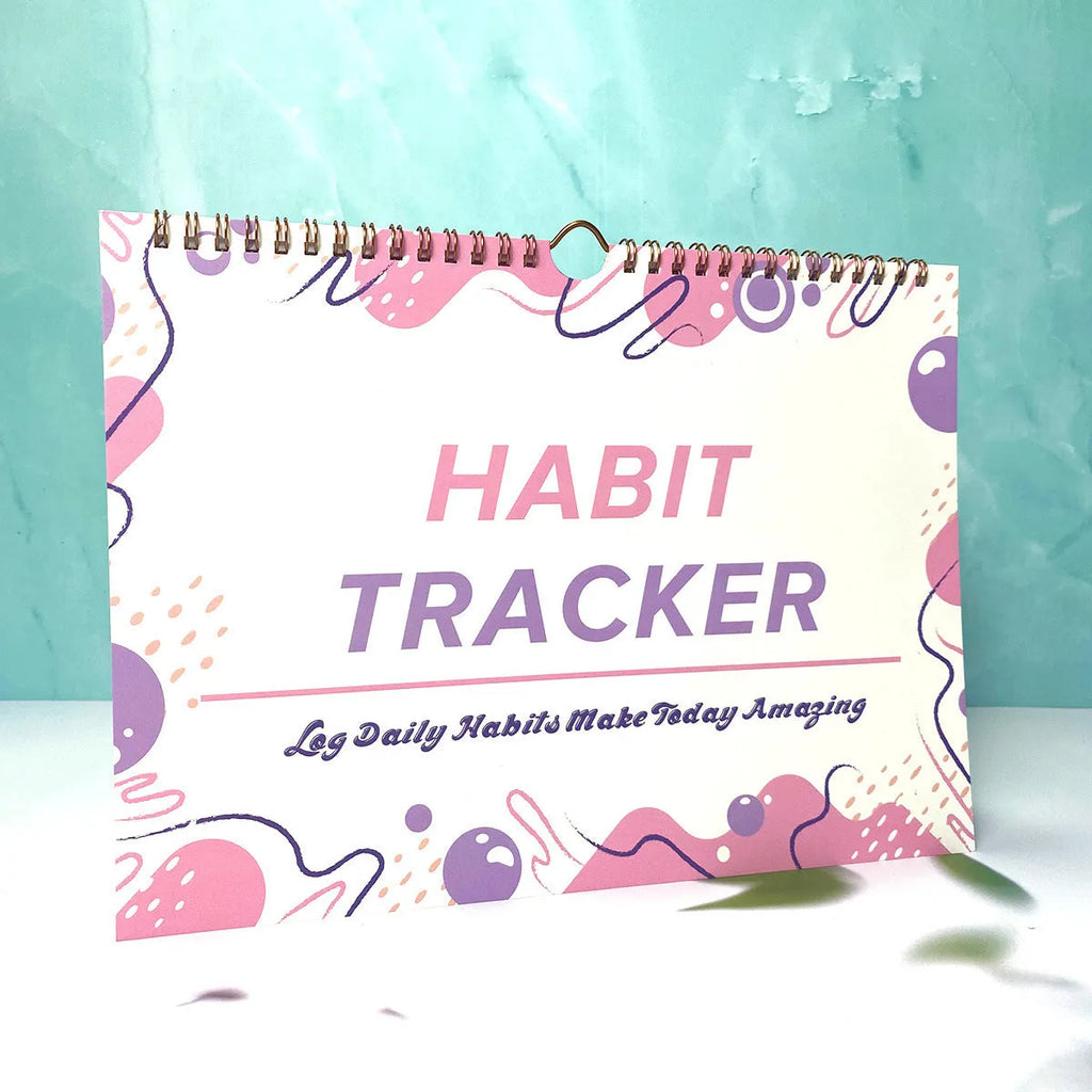 Habit tracking notebook open showing internal pages with 21x28cm dimensions in flower white cover colour