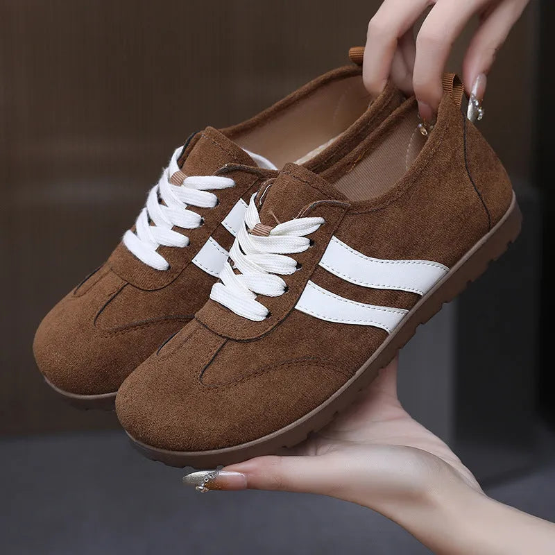 Women's vintage-style sneakers in dark red with a canvas upper and round toe.
