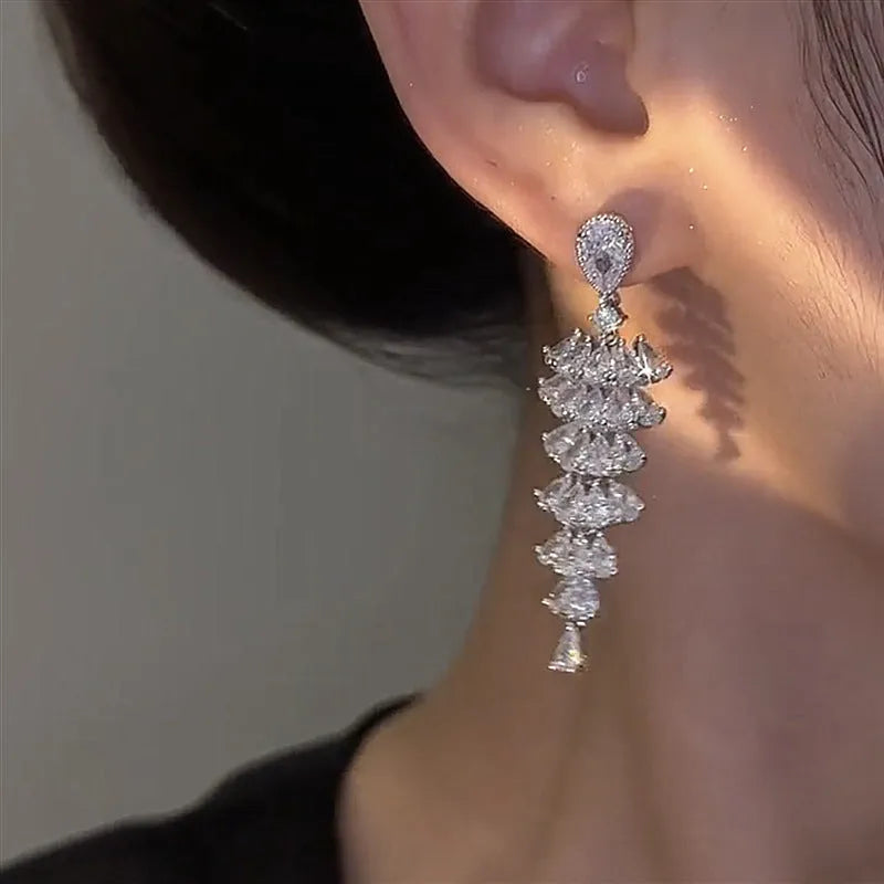 Silver pagoda coloured drop earrings with a sparkling zircon Christmas tree design on copper studs.