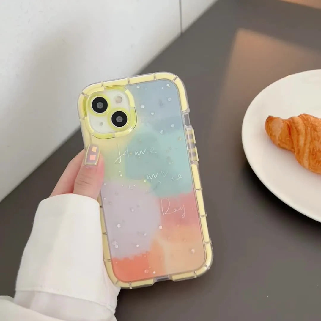 Slim minimalist silicone iPhone case with a yellow edge trim on a table.