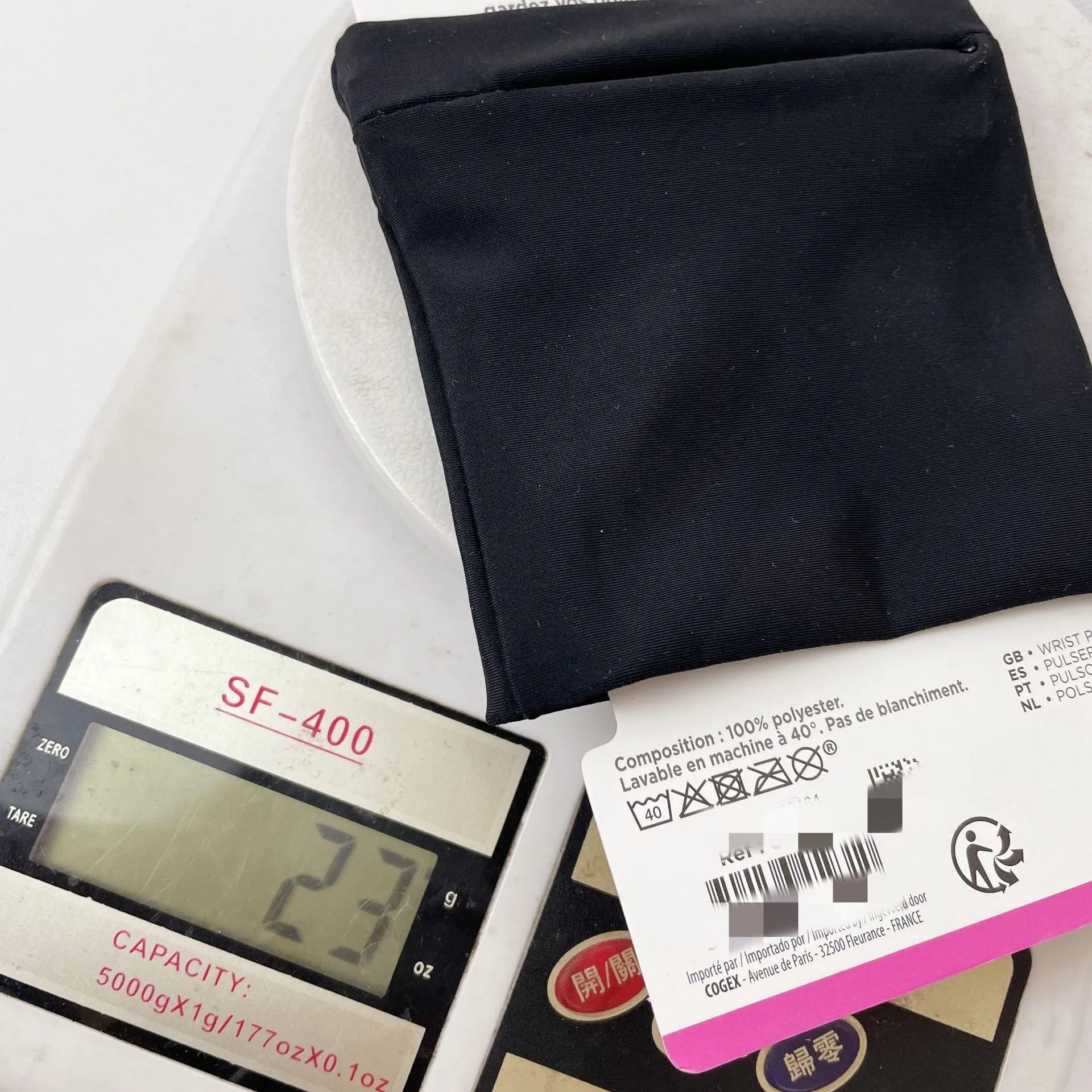 Black wrist bag armband sleeve for mobile phone, shown with dimensions 10cm by 10.5cm.