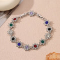 Flower-shaped zinc alloy bracelet with electroplated finish and coloured gem accents