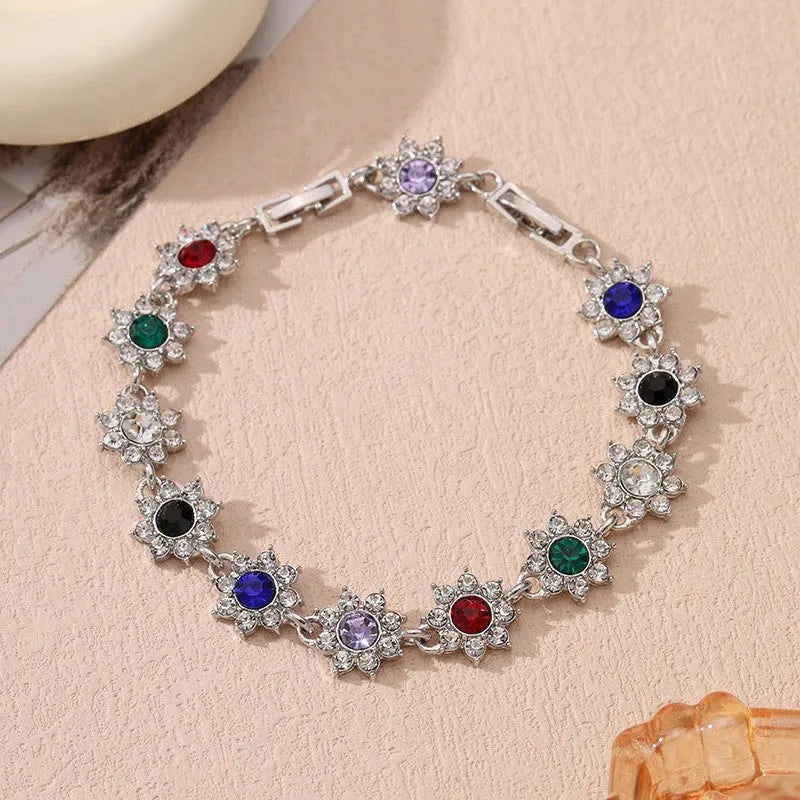 Flower-shaped zinc alloy bracelet with electroplated finish and coloured gem accents
