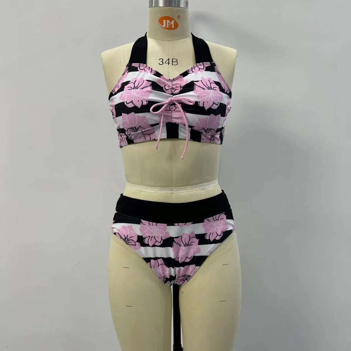 Black women's bikini with printed belly coverage and slimming split leg design.
