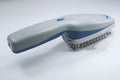White pet grooming ion comb with a removable brush head, showing 78 teeth and a one-key switch.
