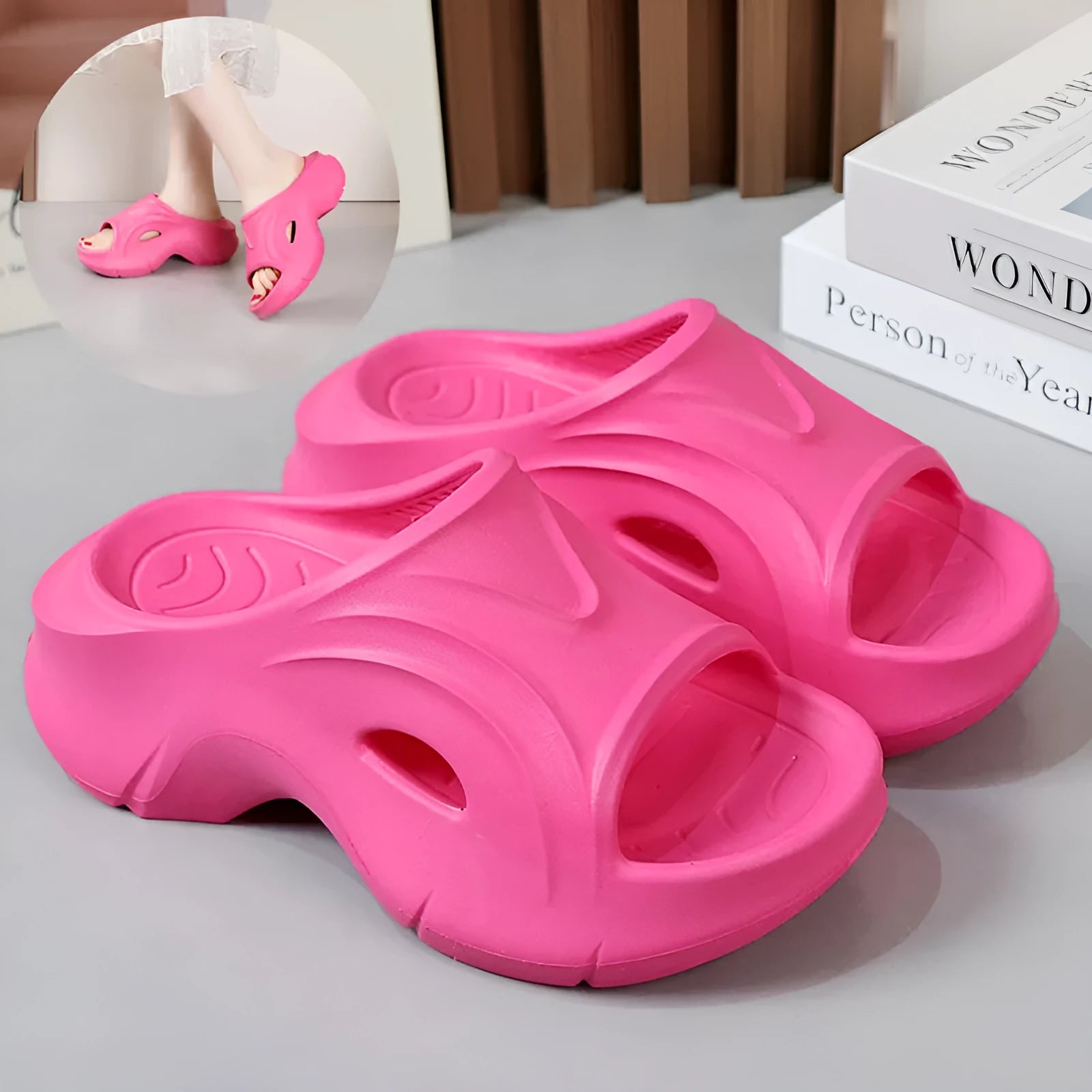 Women's thick-soled EVA beach slippers in rose red colour on a sandy background