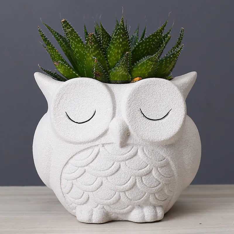 Handmade ceramic owl-design succulent pot in pastel colour measuring 11cm by 9cm by 9cm