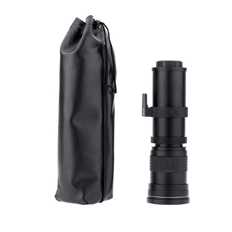 420-800mm manual telephoto zoom camera lens with T-mount adapter ring on a table
