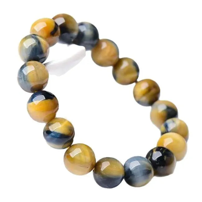 Natural fantasy tiger eye agate bracelet with round geometric beads on a wrist